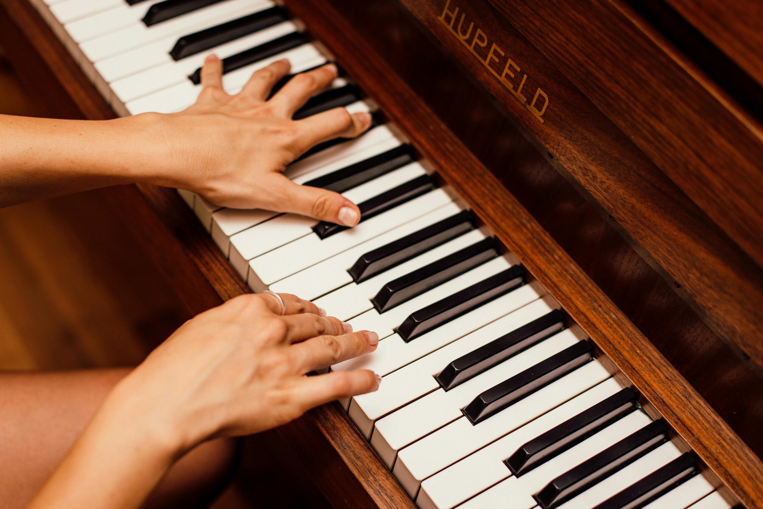 Hands playing piano